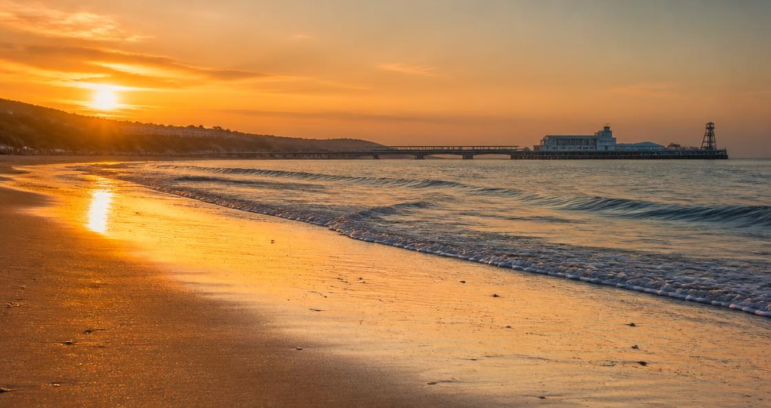 Bournemouth beach at sunset with the pier