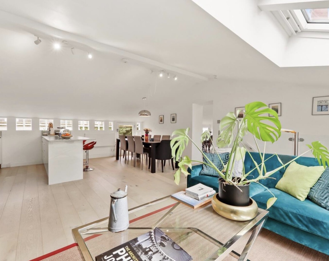 Open-plan kitchen, dining and living space stretching the length of the penthouse